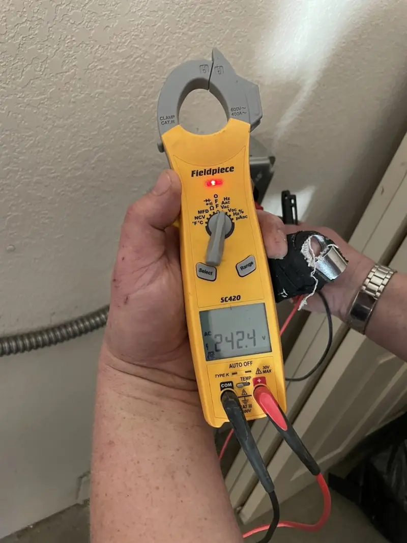 Voltage testing with clamp meter during Recessed Lighting Installation in Hamilton